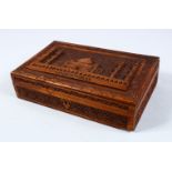 A GOOD INDIAN CARVED HARDWOOD LIDDED BOX, carved in relief to depict the scenes of a temple
