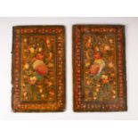 A PAIR OF QAJAR PAINTED LACQUER BOOK COVERS, 23cm x 14.5cm.