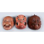 THREE GOOD JAPANESE MEIJI / TAISHO PERIOD LACQUER NOH MASKS, two with real hair details, 6cm. (3)