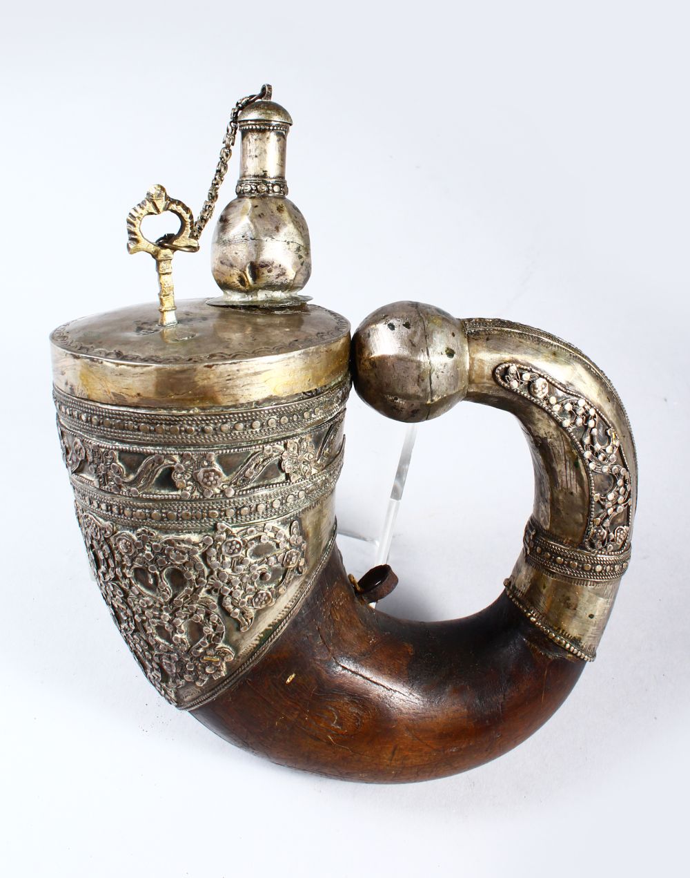 A GOOD EARLY ISLAMIC RHINO HORN AND SILVER MOUNTED COMPLETE POWDER FLASK, with onlaid and engraved