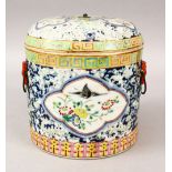 A LARGE 19TH CENTURY CHINESE FAMILLE ROSE PORCELAIN CYLINDRICAL JAR & COVER, decorated upon a blue