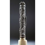 A 19TH CENTURY SOUTH INDIAN IVORY PAGE TURNER, the silver handle chased and embossed with flowers,
