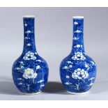 A PAIR OF 19TH CENTURY CHINESE BLUE & WHITE PORCELAIN PRUNUS VASES, decorated with prunus pattern,