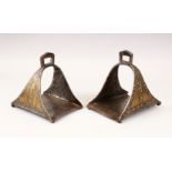 A GOOD EARLY PAIR OF HORSE STIRRUPS, with gold inlaid decoration, 16cm high.