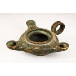 A CAST BRONZE TRIPLE SPOUT OIL LAMP, 15cm wide.