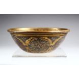 A SMALL SYRIAN BRONZE CIRCULAR BOWL, with silver and copper inlaid decoration, 12.5cm diameter.