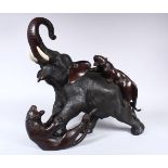 A LARGE JAPANESE MEIJI PERIOD BRONZE OKIMONO ELEPHANT & TIGER GROUP, the elephant in an alarmed
