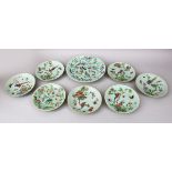 EIGHT 19TH CENTURY CHINESE CANTON CELADON PORCELAIN PLATES, each decorated in a similar way to