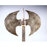 A GOOD QAJAR ENGRAVED STEEL DOUBLE-SIDED AXE, 52cm long, diameter of axe 28cm.