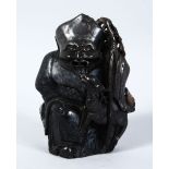 A 19TH / 20TH CENTURY CHINESE CARVED HARDSTONE FIGURE OF TAOIST GOD JUROJIN, seated with a deer to