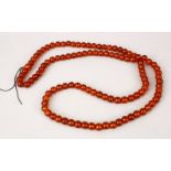 A LARGE 19TH CENTURY CHINESE AMBER ROSARY BEAD NECKLACE, comprising of 109 spherical beads, approx