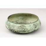 A SELJUK BRONZE CIRCULAR BOWL, with engraved decoration, 16cm diameter.