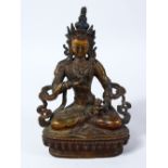 A 19TH CENTURY SINO TIBETAN BRONZE FIGURE OF BUDDHA / DEITY, in a seated meditating position holding