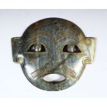 A CARVED JADE MASK, 14.5cm wide.