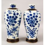 A PAIR OF 19TH CENTURY CHINESE BLUE & WHITE CRACKLE GLAZED PORCELAIN VASES, the body of the vases