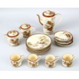 A JAPANESE MEIJI PERIOD SATSUMA PART COFFEE / TEA SET, the set decorated with landscape scenes,