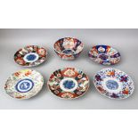 FIVE 19TH CENTURY JAPANESE IMARI PORCELAIN PLATES AND ONE BOWL, consisting of one pair of plates,