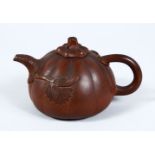 A GOOD 19TH / 20TH CENTURY CHINESE YIXING CLAY TEAPOT, in the form of a pumpkin, with relief