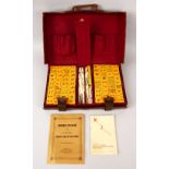 A 20TH CENTURY CHINESE MAHJONG GAME SET IN LEATHER CASE, looks to have all of the parts ( please