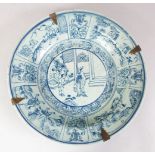 A GOOD 17TH CENTURY STYLE KRAAK BLUE & WHITE PORCELAIN DISH, decorated with scenes of figures in