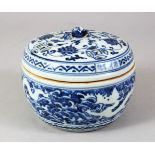 A CHINESE MING STYLE BLUE & WHITE PORCELAIN JAR & COVER, decorated with formal scrolling lotus and