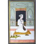 AN INDIAN WATERCOLOUR PAINTING, depicting a seated man with a musical instrument in an interior,