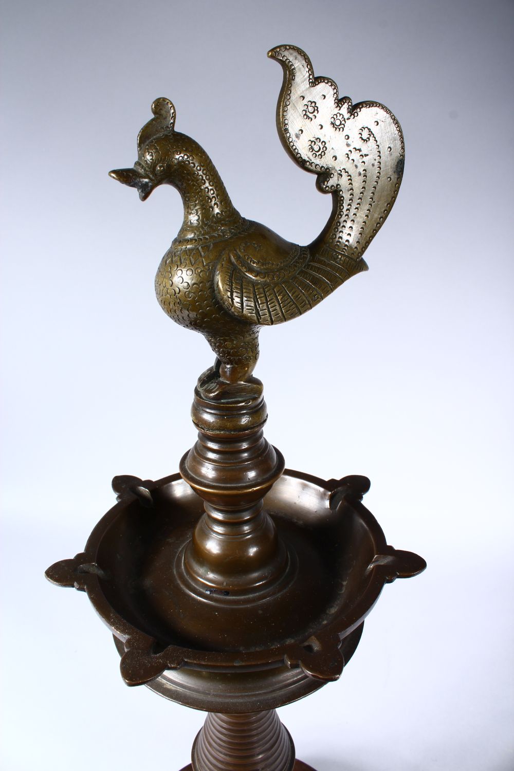 A GOOD 19TH CENTURY INDIAN BRONZE LAMP, with cockerel finial on a circular base, 60cm high. - Image 2 of 4