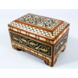 A GOOD ISLAMIC CARVED HARDWOOD AND INLAID SHELL CASKET, the hinged box inlaid with carved mother