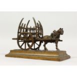 A SMALL BRONZE MODEL OF A HORSE AND CART. 7ins long.
