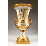 A GOOD PARIS PORCELAIN WHITE AND GILT URN SHAPED VASE on a square base. 15ins high.