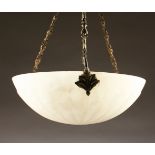 AN ART DECO CIRCULAR ALABASTER LIGHT BOWL with metal hangings. 15ins diameter.