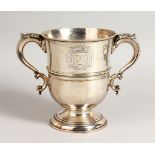 A GEORGE II TWO-HANDLED CUP with acanthus handles. Crested. London 1724. Maker: Thomas Mason.