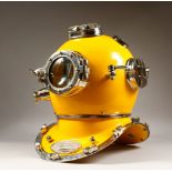 A YELLOW PAINTED AND CHROME PLATED MODEL OF A DIVERS HELMET. 18ins high.