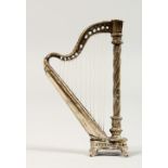 A CONTINENTAL SILVER MINIATURE HARP. 2.5ins high.