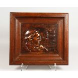 AN OAK FRAMED EMBOSSED COPPER PORTRAIT BUST. 13.75ins x 15.5ins.