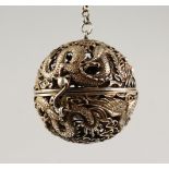 A CHINESE WHITE METAL PIERCED BALL SHAPED TRAVELLING CENSER. 2.5ins diameter.
