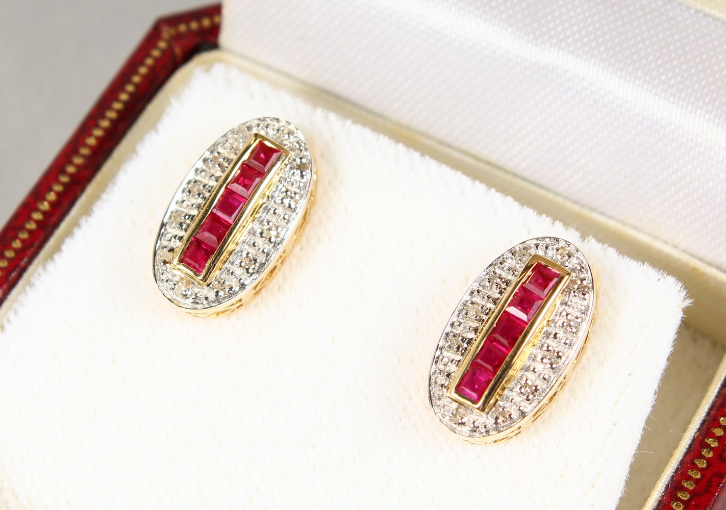 A PAIR OF 9CT GOLD, RUBY AND DIAMOND DECO DESIGN EARRINGS.
