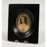 AN OVAL PORTRAIT MINIATURE, young lady wearing a white dress with a rose, signed, in an ebony frame.