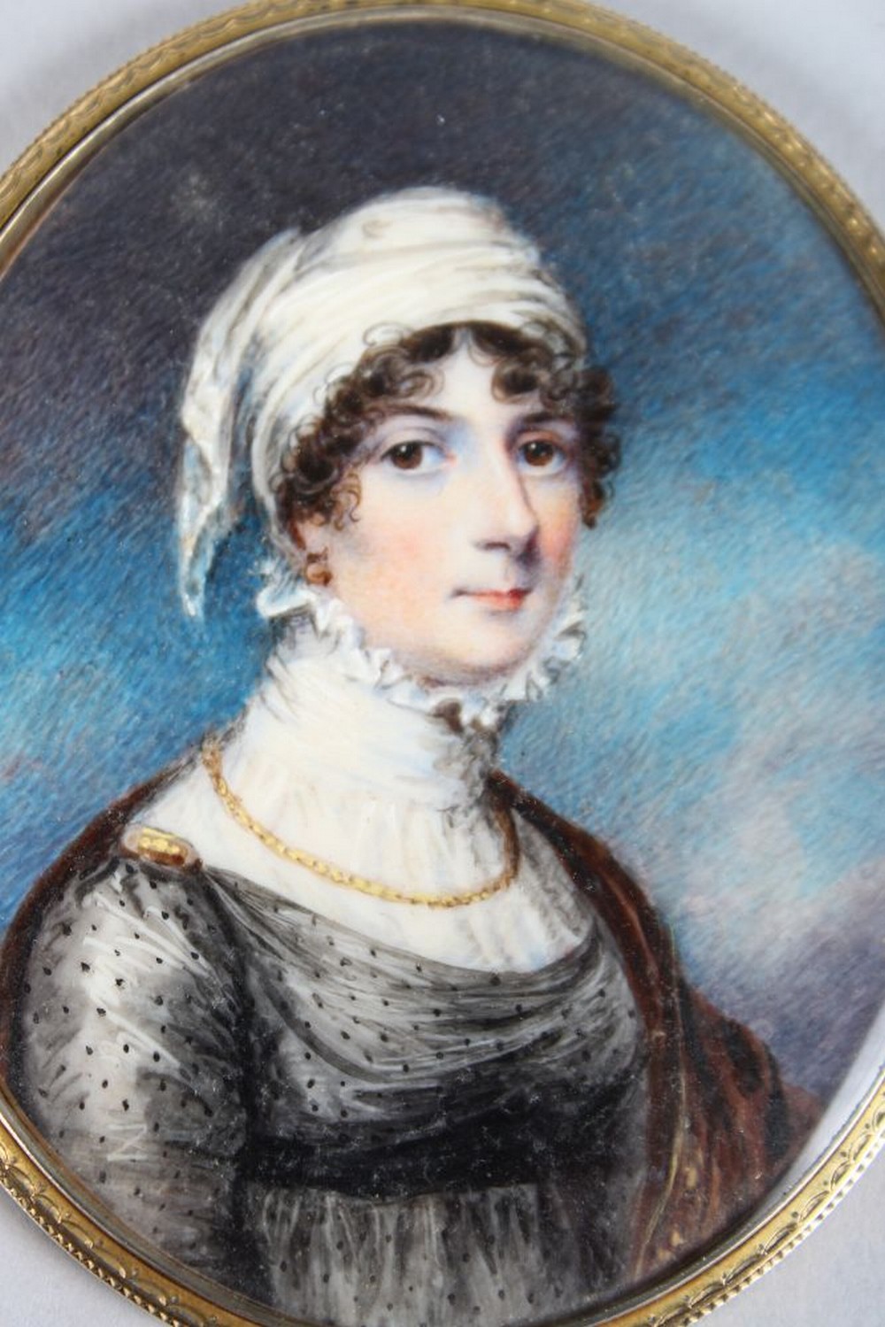 A GOOD OVAL PORTRAIT OF A LADY, wearing a white head scarf, large lace collar, a gold chain and - Image 2 of 2