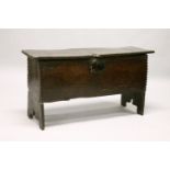 AN 18TH CENTURY OAK SIX PLANK COFFER, with chip carved decoration. 3ft 6ins long x 1ft 10ins high