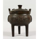 A CHINESE BRONZE CIRCULAR TRIPOD CENSER WITH LID. 6ins high.