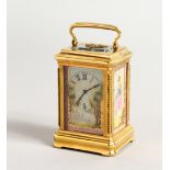 A SUPERB RUSSIAN SILVER CARRIAGE CLOCK, with painted porcelain panels. 3ins high, in a Faberge box.