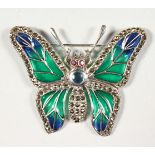 A SILVER, SAPPHIRE, RUBY AND MARCASITE BUTTERFLY BROOCH.