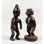 TWO CARVED WOOD STANDING TRIBAL FIGURES. 7ins and 7.5ins high.