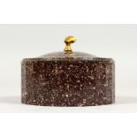 A SUPERB 19TH CENTURY PORPHYRY CIRCULAR BOX AND COVER. 4.75ins diameter x 2.25ins deep. (AF).