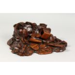 A GOOD BLACK FOREST STYLE OAK CARVED DESK STAND, carved with a barrel, lantern, leaves and other