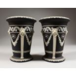 A PAIR OF WEDGWOOD BLACK AND WHITE JASPER WARE VASES, with lion ring handles, medallions and