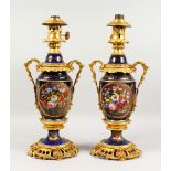 A VERY GOOD PAIR OF 19TH CENTURY FRENCH ORMOLU AND PORCELAIN LAMPS, painted with reverse panels of