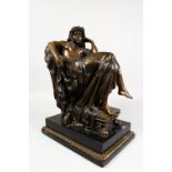 A VICTORIAN STYLE BRONZE OF A RECLINING SEMI-NUDE FEMALE, 20th Century, on a marble base. 17ins high