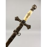 A MASONIC SWORD WITH SCABBARD, with engraved ivory handle. 38.5ins long overall.